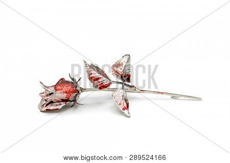 Silver rose splashed with blood over white background 