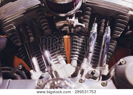 Motorcycle Engine, Metallic Background With Exhaust Pipes.
