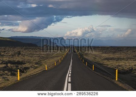Asphalt Straight Road In Iceland Through The Lava Field At Summer Season