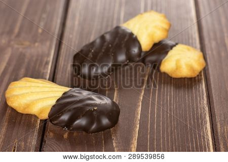 Group Of Three Whole Lazy Cookie With Chocolate On Brown Wood
