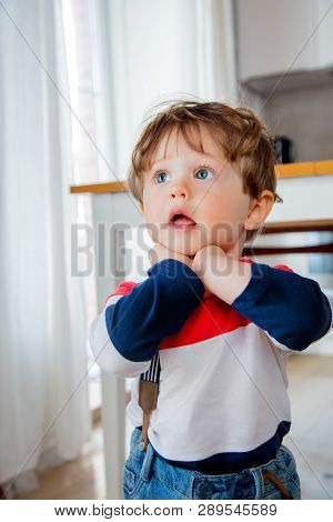 Little Todler Boy Stay At Kitchen In A Day And Watiching Something