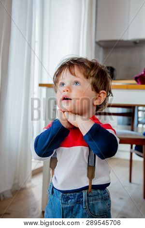 Little Todler Boy Stay At Kitchen In A Day And Watiching Something