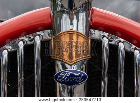 Many Glacier, United States: June 29, 2018: White And Ford On Red Jammer Grill