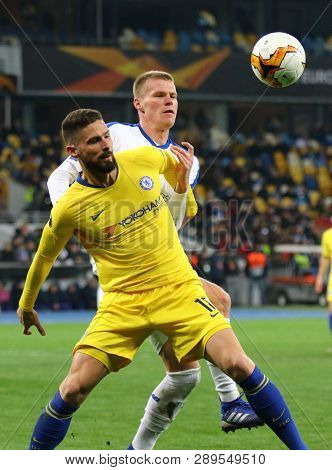 Kyiv, Ukraine - March 14, 2019: Olivier Giroud Of Chelsea (in Yellow) Fights For A Ball With Mykyta 