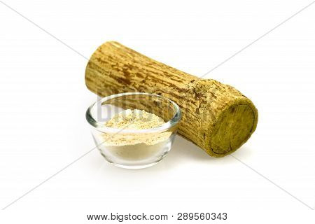 Thanaka Wood And A Cup Of Yellowish-white Powder Made From Ground Bark. Thanaka Paste Applied To The
