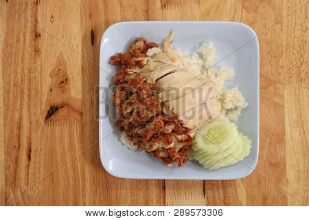 Hainanese Chicken Rice With Roasted Chicken On Wooden Table.hainanese Chicken Rice Is A Dish Of Poac