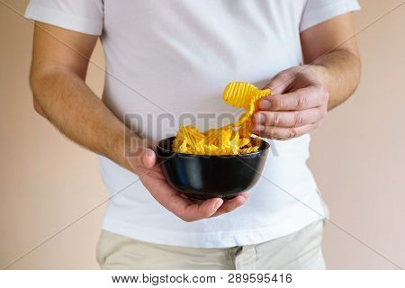 Processed Food, Unhealthy Diet, Imbalanced Ration. Overweight Man Eating Salted Fattening Potato Chi
