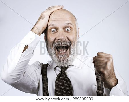 Cheerful Successful Senior Businessman Celebrating