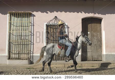 Trinidad, Cuba-september 27,2016: Local On Horse In A Street Of The Old Colonial Town Of Trinidad, C