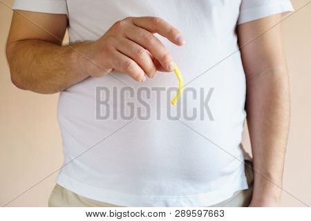 Processed Products, Fast Food, Unhealthy Diet, Imbalanced Ration. Overweight Man Eating Salted Fatte