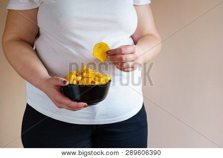 Processed Food, Unhealthy Diet, Imbalanced Ration. Overweight Woman Eating Salted Fattening Potato C