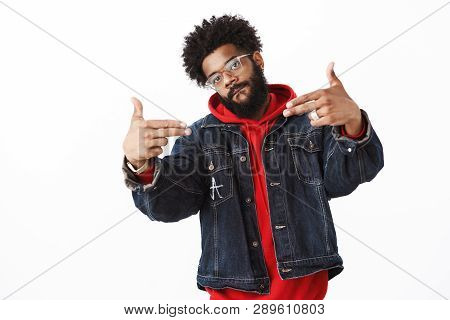 Cool And Stlyish Handsome African-american Young Male Rapper With Beard And Piercing Showing Finger 
