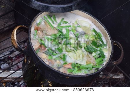 Soup Of Mushrooms With Green Onion In Pan On Bonfire