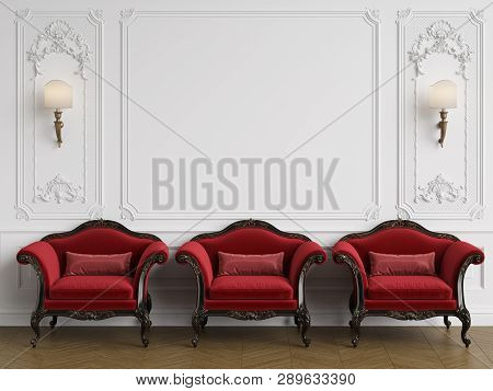 3 Classic Armchairs In Red Color In Classic Interio With Copy Space.walls With Mouldings. Floor Parq