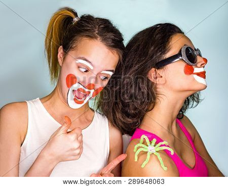 The Girl Waiting For Her Sister Noties The Toy Spider On Her Shoulder. The Tradition Of Celebrating 