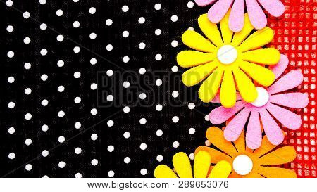 Birthday Gift Card With Red  Ribbon Decoration And Multicolor Flowers Laying On Black Dotted Backgro