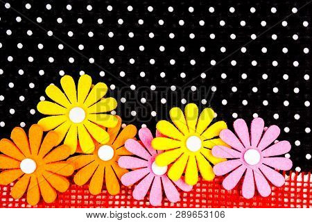 Birthday Gift Card With Red  Ribbon Decoration And Multicolor Flowers Laying On Black Dotted Backgro