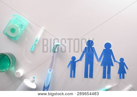 Concept Of Oral Hygiene For The Family With Tools And Products On White Table. Horizontal Compositio