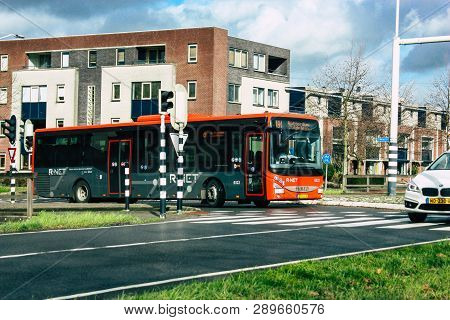 Papendrecht Netherlands March 12, 2019 View Of A Classic Dutch City Bus Rolling In The Streets Of Pa