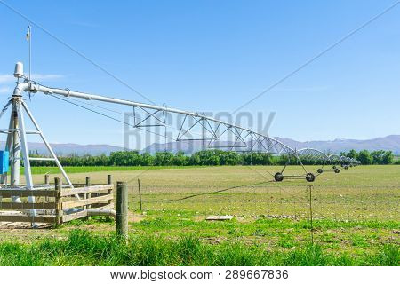 Large Center Pivot Irrigation System Running On A Farm In Canterbury, New Zealand. Long Movable Boom