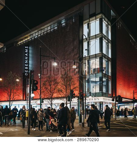 London, Uk - March 9, 2019: People Walking In Front Debenhams Store On Oxford Street, London, In The
