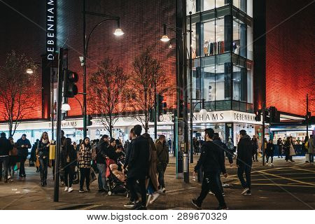 London, Uk - March 9, 2019: People Walking In Front Debenhams Store On Oxford Street, London, In The