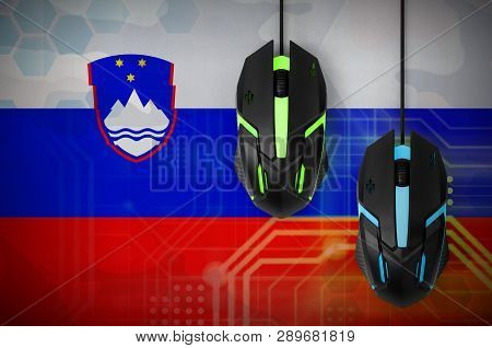 Slovenia Flag  And Two Mice With Backlight. Online Cooperative Games. Cyber Sport Team