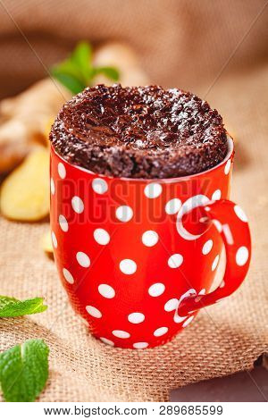 Baked Ginger Chocolate In Red Cup. Close Up