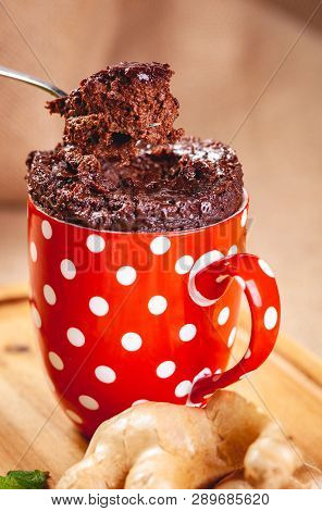Baked Ginger Chocolate In Red Cup. Close Up