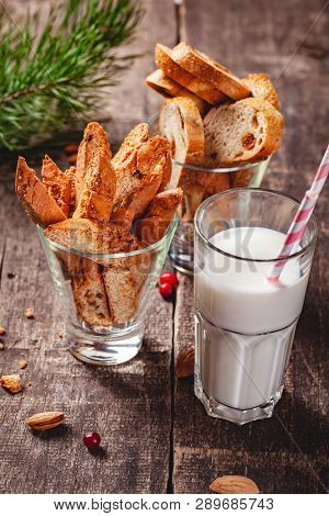 Biscotti Or Cantucci With Milk On Wooden Rustic Table. Close Up. Christmas Or New Year Food Concept
