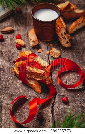 Cantucci With Milk On Wooden Rustic Table. Close Up.  Christmas Or New Year Food Concept