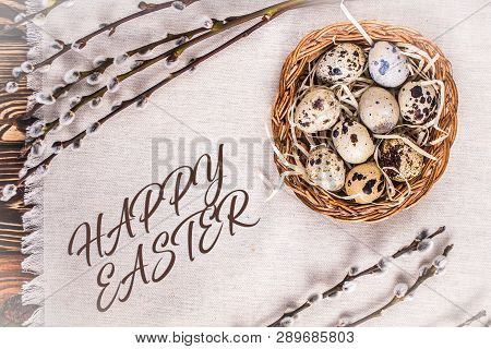 Happy Easter. Easter Background With Eggs In A Basket And Pussy-willow On Coarse Cloth