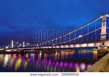 Krymsky Bridge Or Crimean Bridge  Across The Moskva River In Moscow In The Rays Of Setting Sun In Th