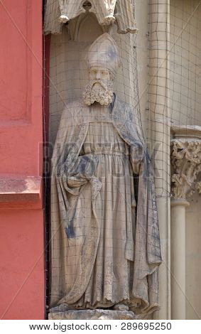 WURZBURG, GERMANY - JULY O4, 2018: Statue of Saint on the portal of the Marienkapelle in Wurzburg, Bavaria, Germany