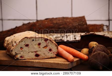 Healthy Bread With Rood Vegetables On A Cutting Board.