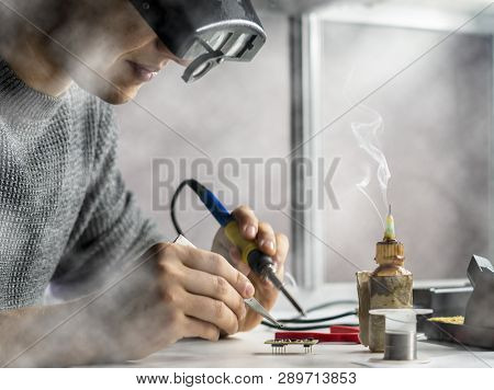 Soldering Iron With Smoke From Boiling Rosin Or Colophony