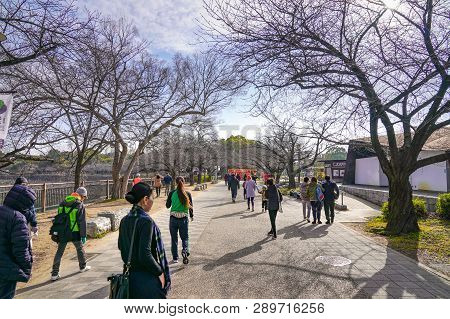 Osaka, Japan - 4 Mar 2018: Japanese, Tourists, Travelers Walked Around Osaka Castle Park In Mar 2018