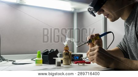 Soldering Iron With Smoke From Boiling Rosin Or Colophony