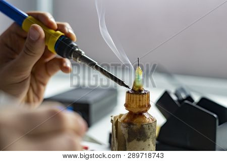 Soldering Iron With Smoke From Boiling Rosin Or Colophony