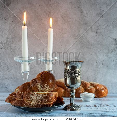 Shabbat Shalom - Challah Bread, Shabbat Wine And Candles On Wooden Table.