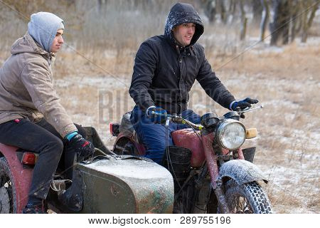 Taraclia, Moldova - 23. 02. 2019: A Team On A Soviet Retro Motorcycle With A Sidecar In The Mud And 