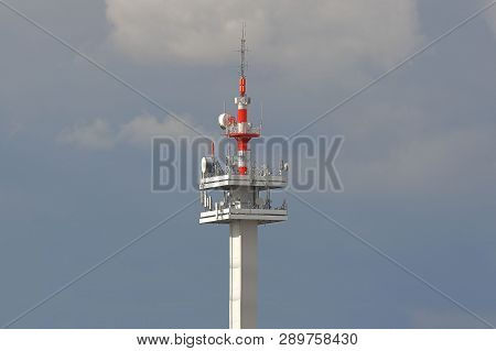 Radio Tower With Antennas On A Blue Sky Background. Metal Construction. Wireless Network. Transmit T