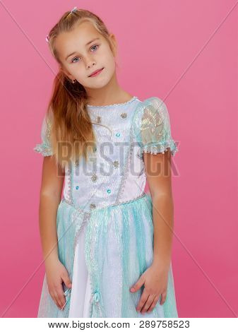 Beautiful Little Girl On A Pink Background. Concepts Style And Fashion, Happy Childhood.