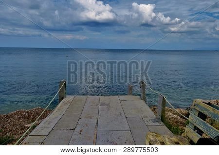 Beautiful View Of The Blue Sea With A Bridge