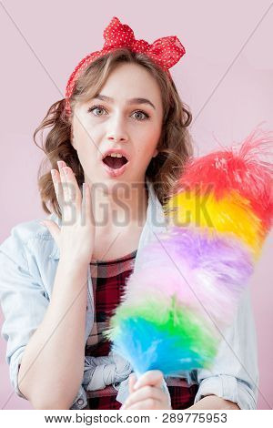Cleaning Pin Up Woman. Smiling Pinup Girl Holds Colorful Duster Brush. Cleaning Service. Pin-up Girl