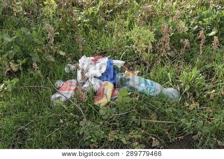 Sint Gillis Waas, Belgium - March 05, 2019, Cans, Plastic Bottles And Plastic Bags Dumped Into The N