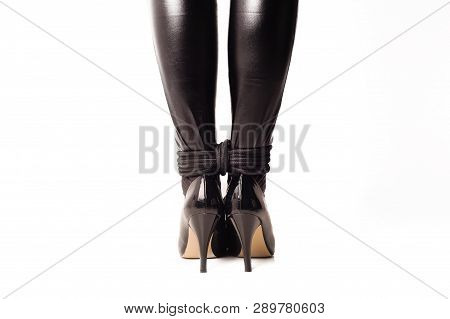Bound Women's Ankles In Latex Stockings And Shiny Black Shoes