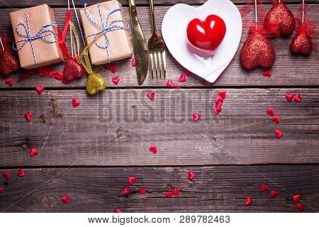 Border From Red And Gold Decorative Hearts, Boxes With Presents And Plate, Cultery On Vintage Wooden