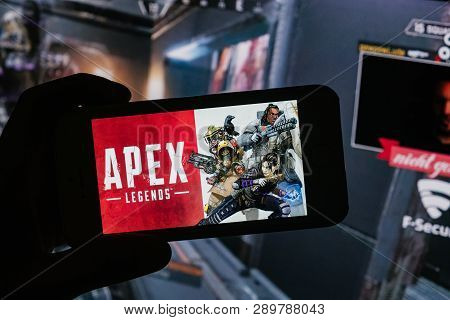 Apex Legends Logo Is Displayed On Mobile Phone Hold By A Young Boy Who Plays