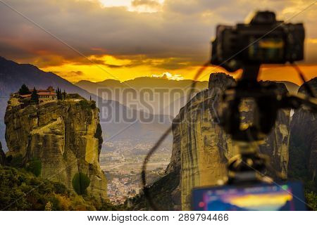 Professional Camera On Tripod Taking Picture Film Video From The Holy Trinity Monastery On Cliff At 